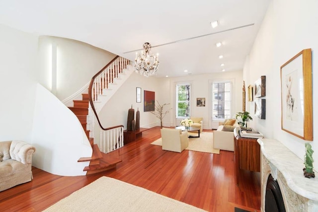 entrance foyer with light wood-style floors, recessed lighting, a chandelier, and stairs