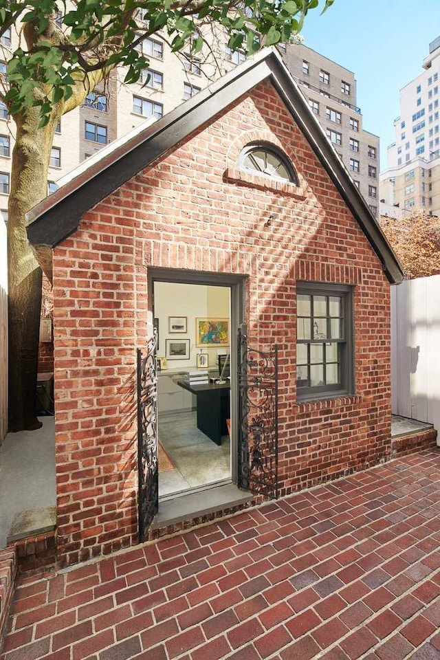 entrance to property with brick siding