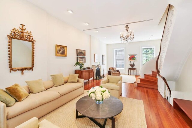 living room featuring hardwood / wood-style floors and a chandelier