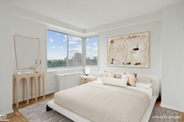 bedroom featuring baseboards