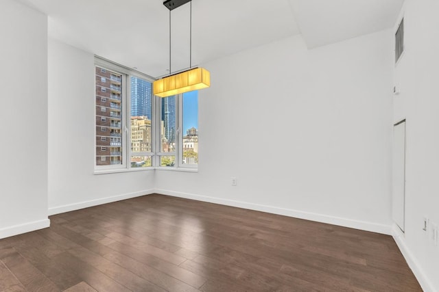 unfurnished dining area with dark hardwood / wood-style floors