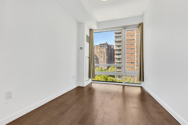 empty room featuring dark hardwood / wood-style floors