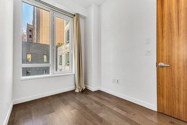 spare room featuring hardwood / wood-style floors