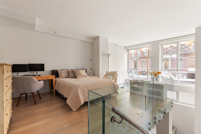 bedroom featuring light wood-style floors