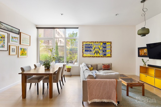 interior space featuring light wood finished floors and baseboards