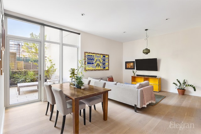 dining space with light wood finished floors