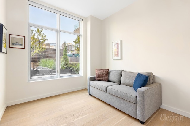 sitting room featuring light wood-style floors and baseboards