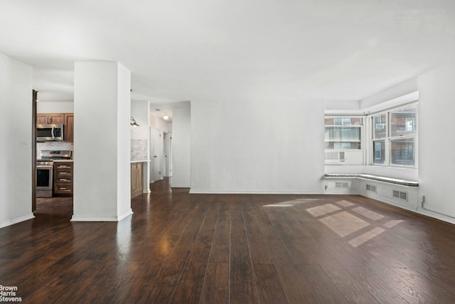 unfurnished living room with dark hardwood / wood-style floors