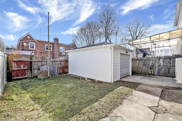 view of yard with a garage and an outdoor structure