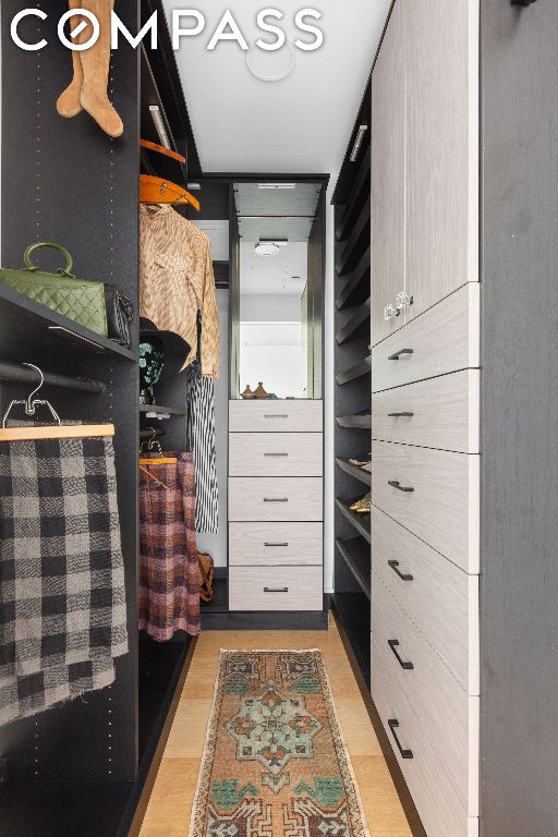 walk in closet featuring light wood-type flooring