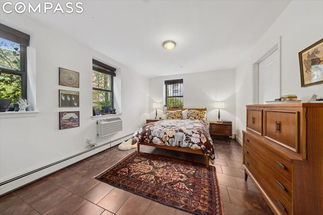 tiled bedroom with an AC wall unit and a baseboard heating unit