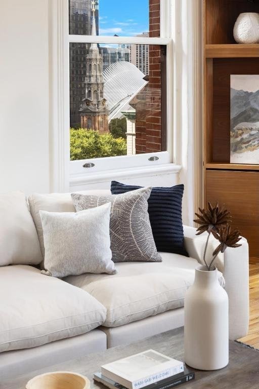 living area with hardwood / wood-style flooring