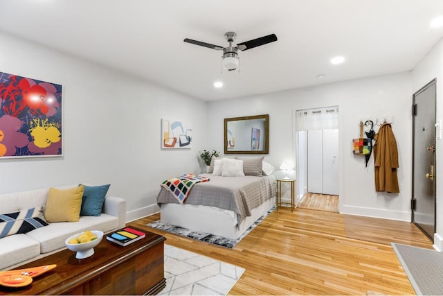 bedroom featuring ceiling fan and hardwood / wood-style floors