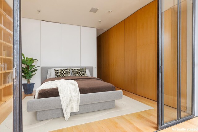 bedroom with wood finished floors