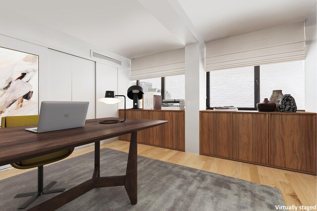 office area with light wood finished floors
