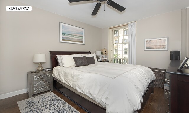 bedroom with dark wood-type flooring and ceiling fan