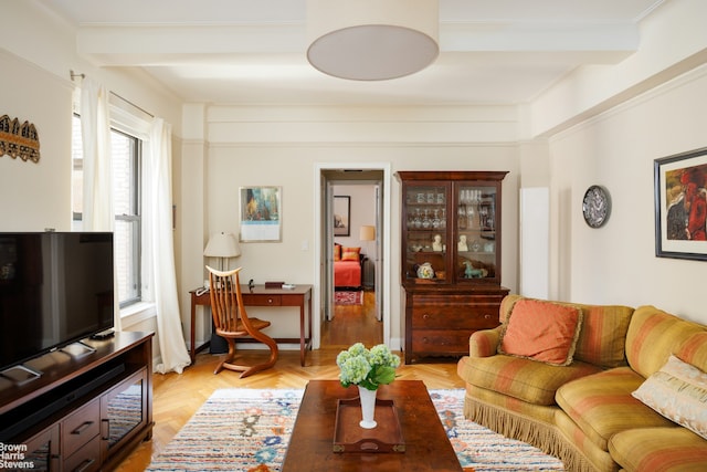 living area with beamed ceiling