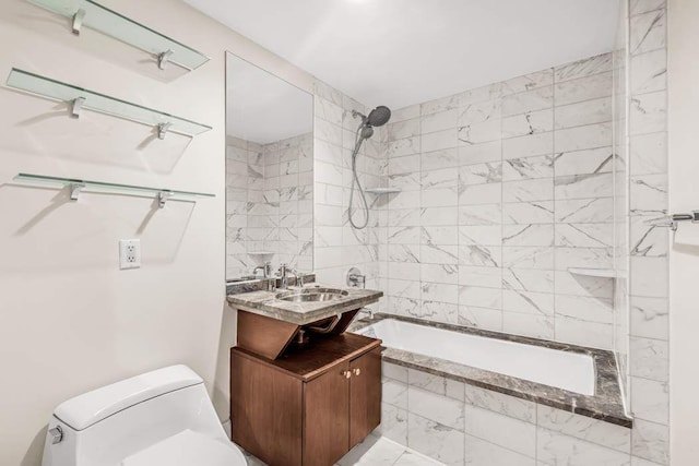 full bathroom featuring tiled shower / bath, vanity, and toilet