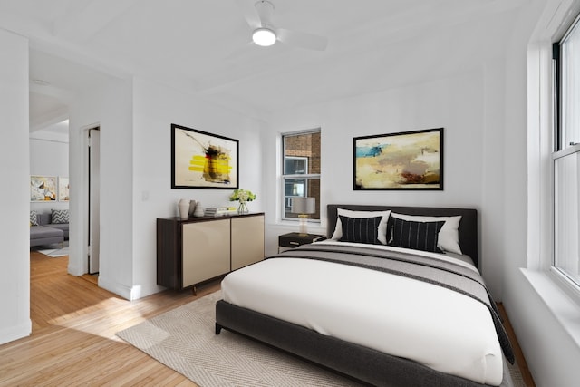 bedroom with ceiling fan and light hardwood / wood-style floors