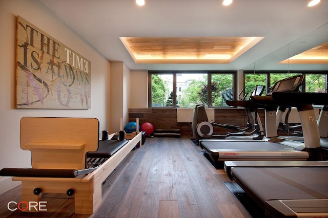 interior space with wooden walls and dark hardwood / wood-style flooring