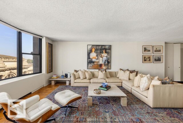 bedroom featuring carpet and a textured ceiling