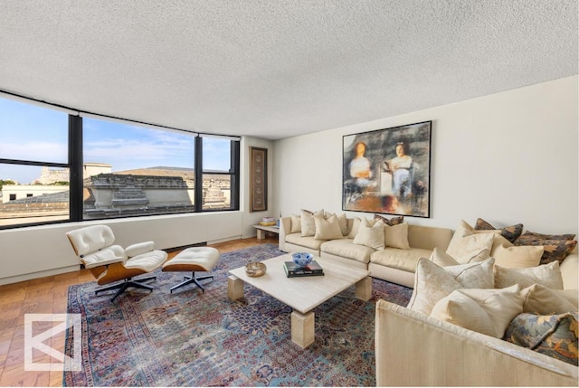 living room with hardwood / wood-style floors and a textured ceiling