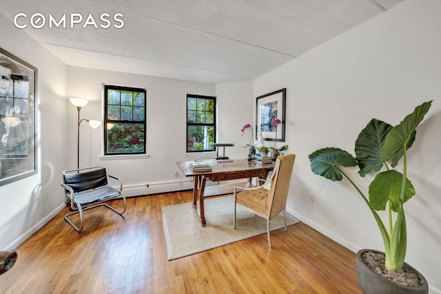 office area featuring wood finished floors and baseboards