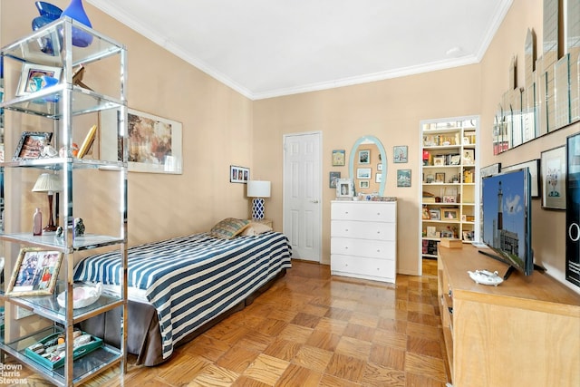 bedroom featuring crown molding and light parquet flooring