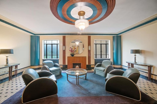 carpeted living room featuring a raised ceiling and crown molding