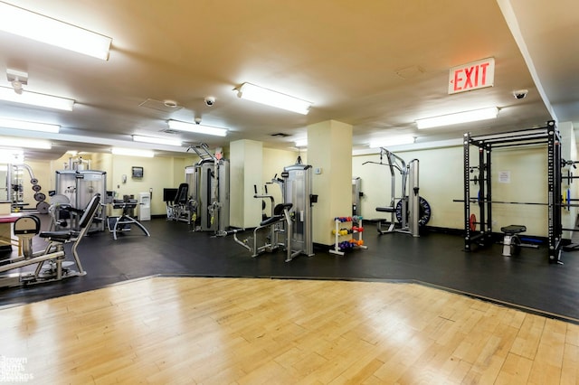 exercise room with wood finished floors