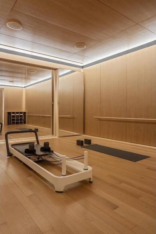 workout room with wooden walls and hardwood / wood-style floors