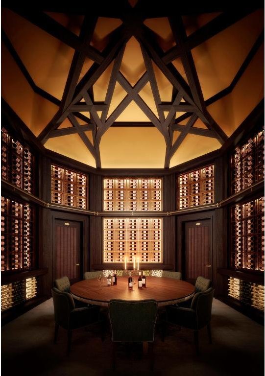 wine room with a high ceiling and carpet floors