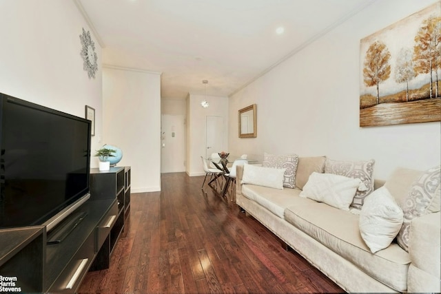 living room with dark hardwood / wood-style floors and ornamental molding