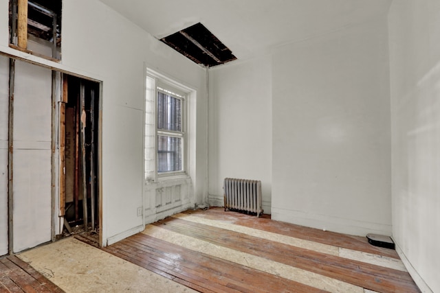 unfurnished room with radiator