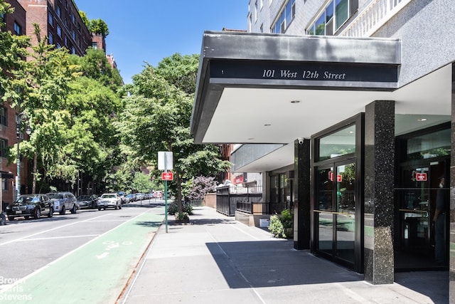 exterior space with traffic signs and sidewalks