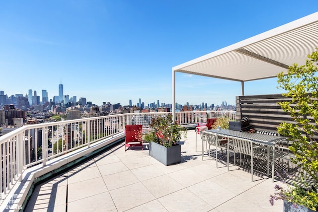 view of patio with a view of city and a pergola