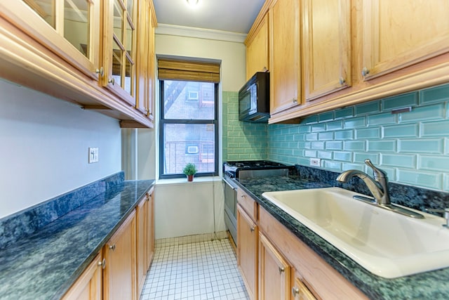 kitchen with ornamental molding, sink, gas stove, and a wealth of natural light