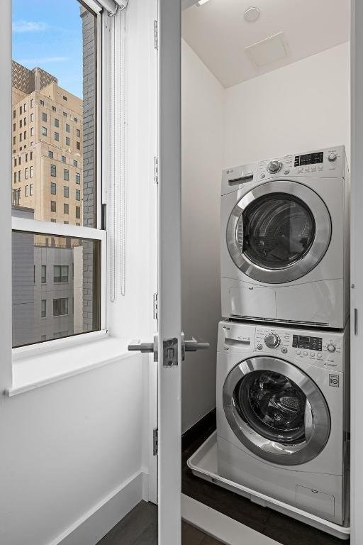 washroom with stacked washer and clothes dryer