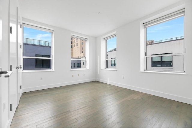 spare room featuring dark hardwood / wood-style flooring