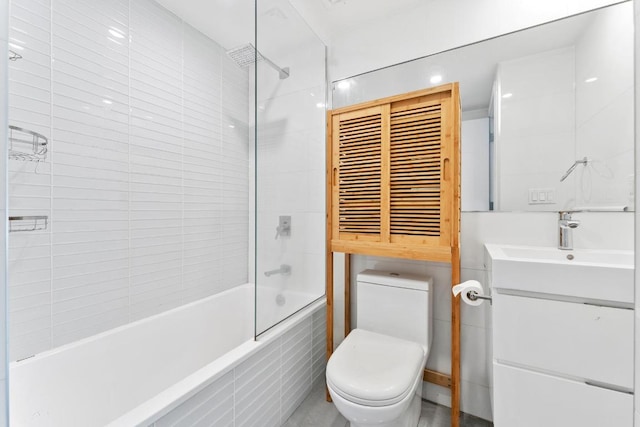 full bathroom with vanity, toilet, and tiled shower / bath combo