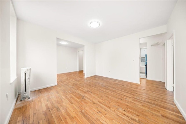 spare room with light hardwood / wood-style floors