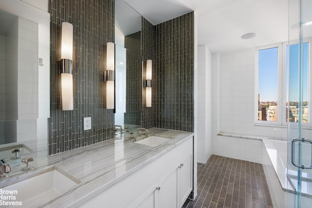 bathroom featuring tile walls, sink, and tile patterned floors