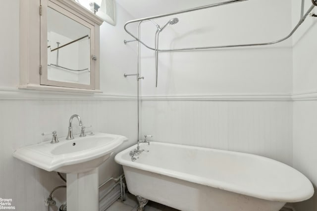 bathroom featuring a tub and sink