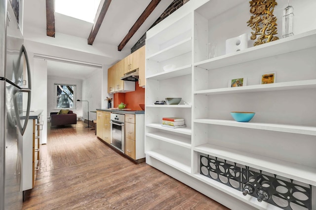 kitchen featuring open shelves, appliances with stainless steel finishes, light brown cabinets, and under cabinet range hood