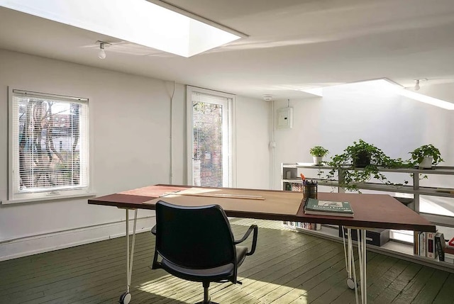 office space featuring hardwood / wood-style flooring and baseboards