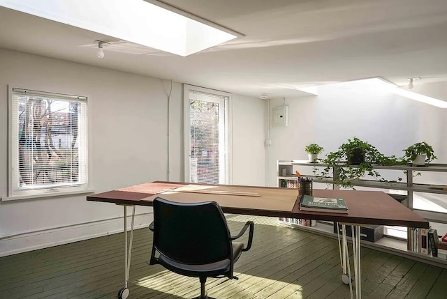 office area featuring a skylight and hardwood / wood-style floors