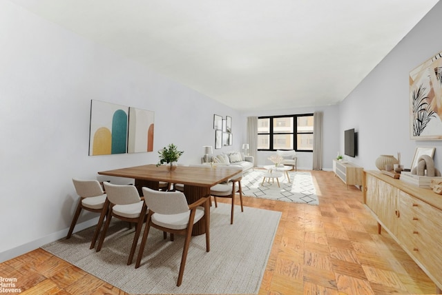 dining space with light parquet floors