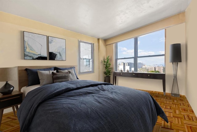 bedroom with parquet flooring