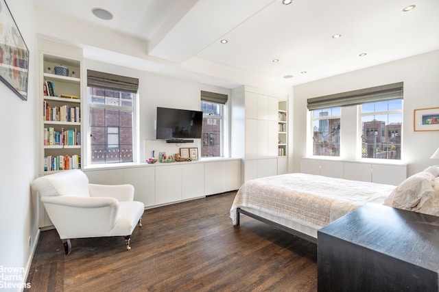 bedroom with dark hardwood / wood-style floors