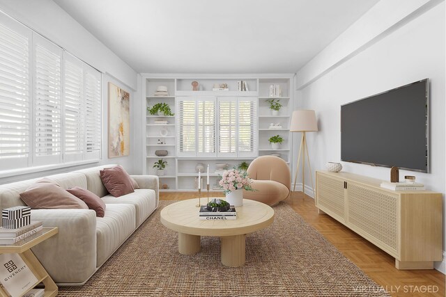 7 Park Ave Unit 23, New York City, NY 10016 - living room featuring healthy amount of natural light and built in features